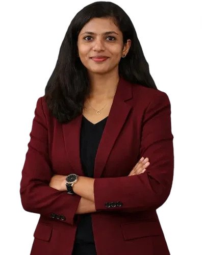 Female freelance digital marketer in Kollam, professional in a maroon blazer, smiling with arms crossed, isolated on a transparent background